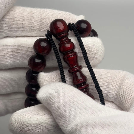 Personalized coral tasbih: 33 12mm black coral beads with red highlights