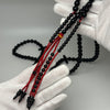 Tijani Tasbih in Yusr Khor 10 mm – Black Coral with Red String | Kourous Handmade