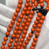 Vue rapprochée Marjane orange, corail poli à la main d'Indonésie pour tasbih Tijani