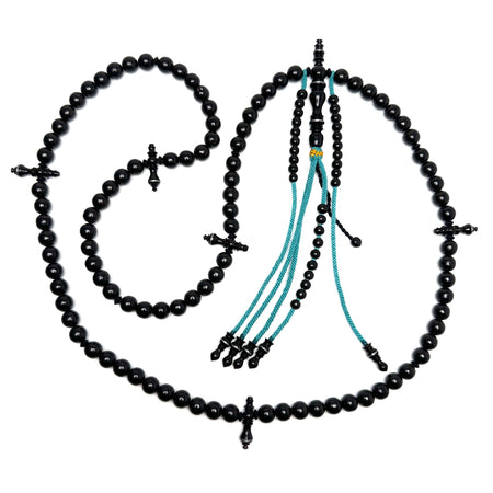 Tasbih monocolor artistique - chapelet Yusr noir et turquoise sur coton blanc