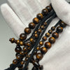Tasbih Tijani in Yusr Khor 10 mm – Gold Coral, Black String | Kourous Artisanal 